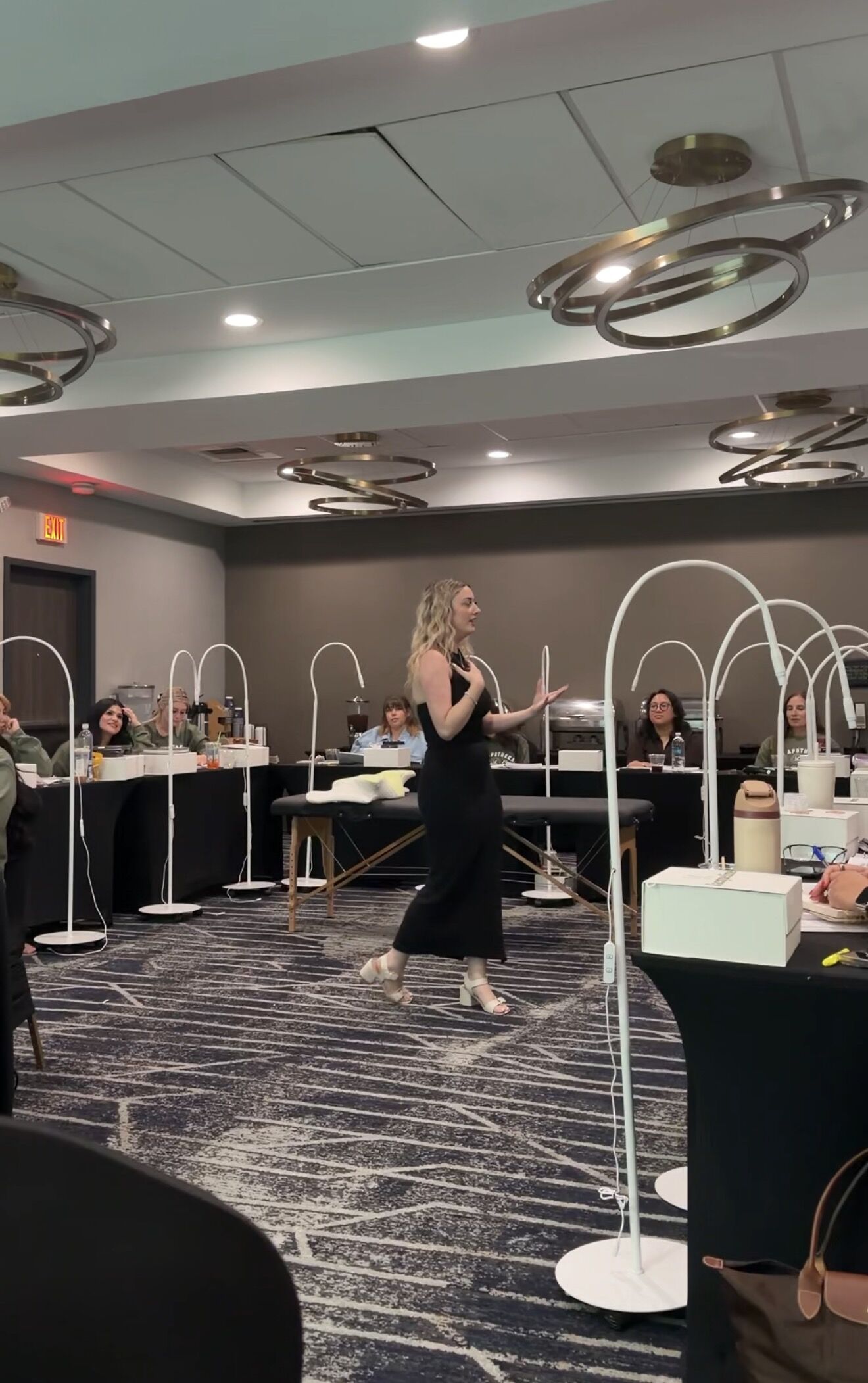 Cortney leading a large class at a tour venue