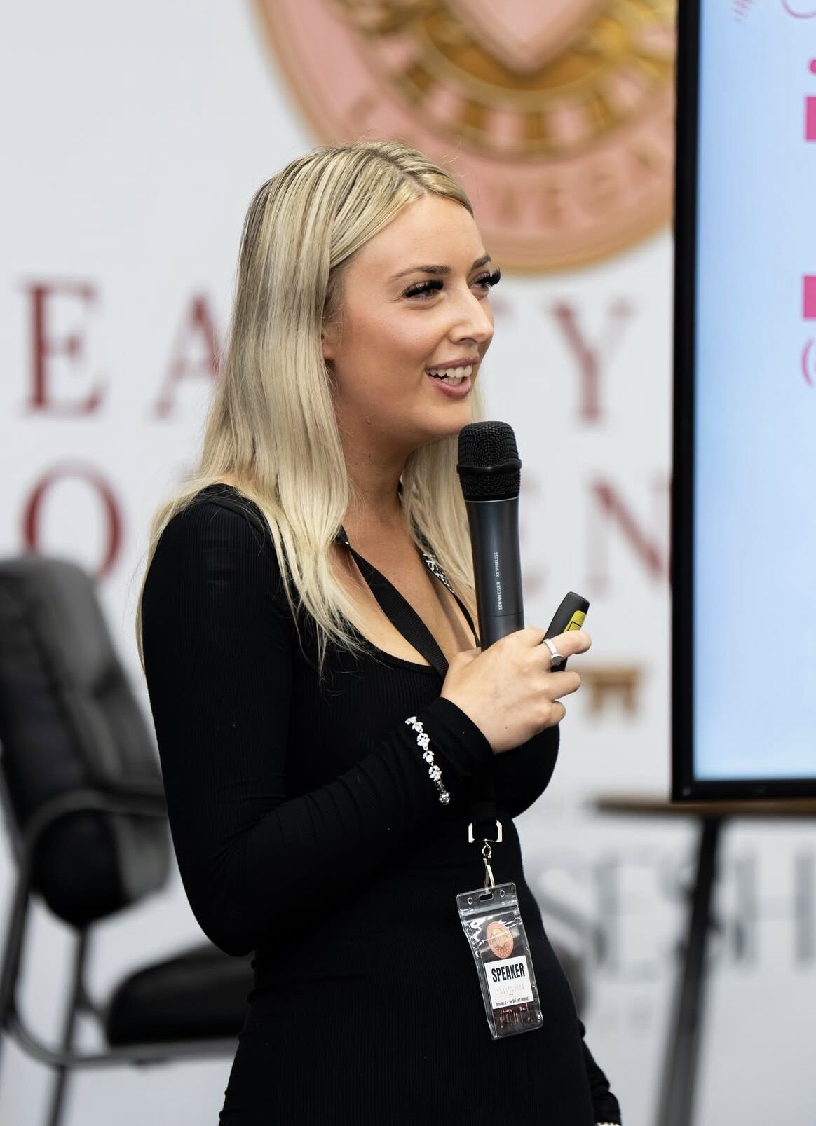 Cortney De Voe speaking at a lash convention