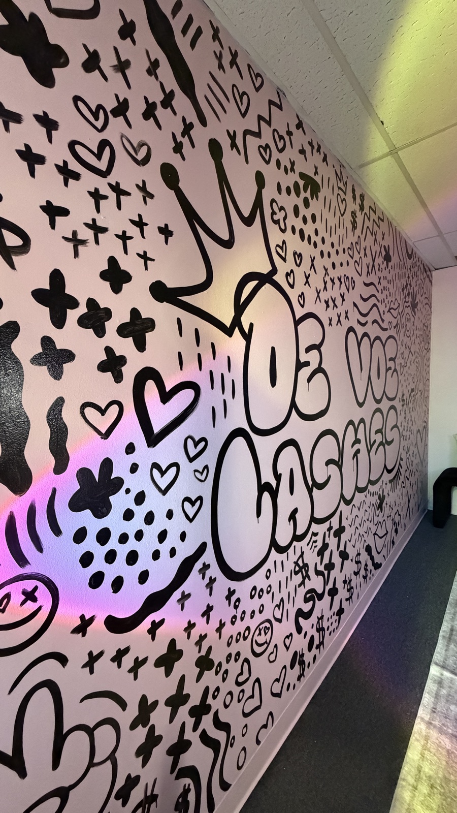 The doodle mural catching a holographic rainbow of light