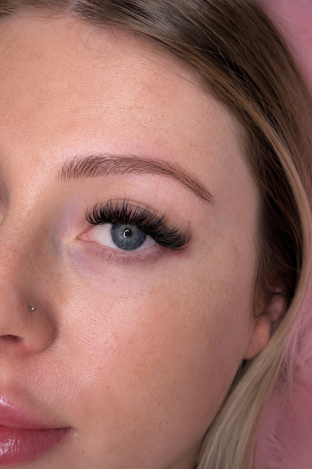 A wispy set on blue eyes, close up